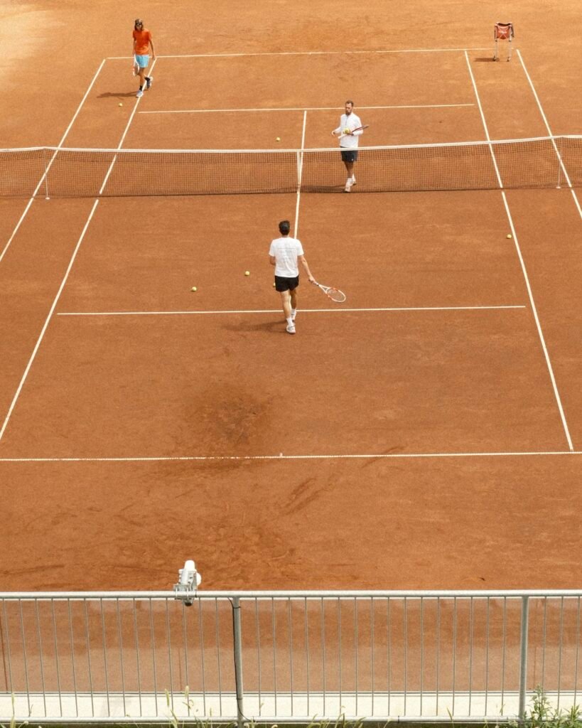 Tennis players practicing on the clay courts at Thiem Academy Burgenland during training session